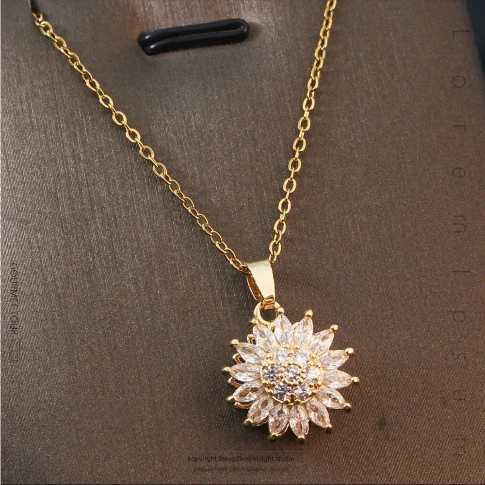 Titanium Steel Rotating Flower Pendant Necklace in Gold